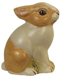 Tan & white sitting rabbit with ears back