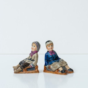 Tiny Boy and Girl on Sleds Pair