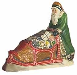 Father Christmas Pushing Shoe Sled with Gifts