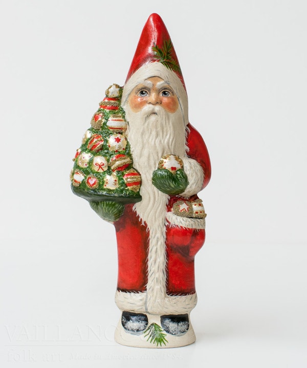 Santa Holding Tree of Ornaments