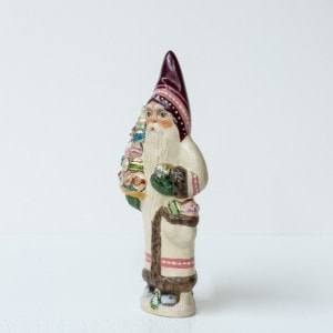 White Father Christmas Holding Ornaments