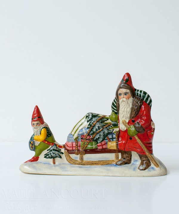 Gnome Pulling Sled of Gifts with Father Christmas