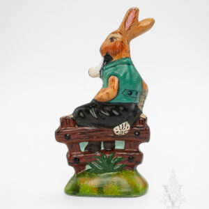 Rabbit Sitting on Fence with Eggs and Pipe