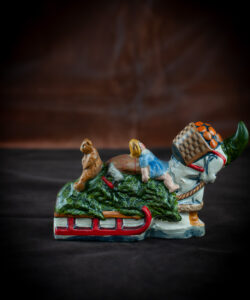 Santa Pulling Sled with Tree and Bear