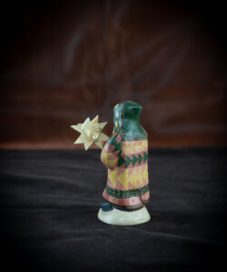 9th Annual Starlight Santa Holding Hand-Folded Paper Moravian Star