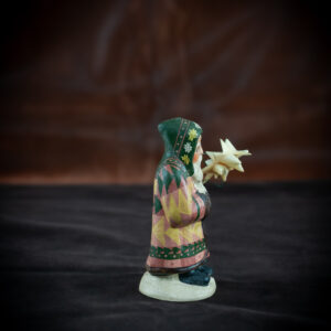 9th Annual Starlight Santa Holding Hand-Folded Paper Moravian Star