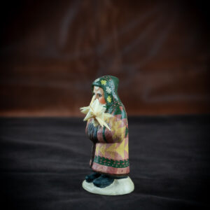 9th Annual Starlight Santa Holding Hand-Folded Paper Moravian Star