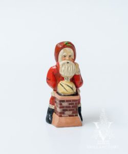 Santa Pushing Sack into Chimney