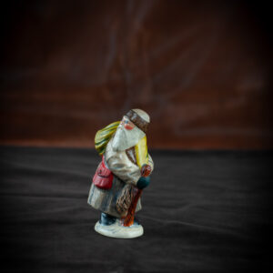 Belsnickel in Brown Coat with Switches and Stick