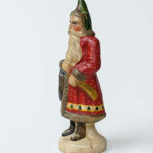 Father Christmas in Red Coat with White Dots and Soldier in Pocket