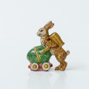 Rabbit Pushing Egg on Wheels