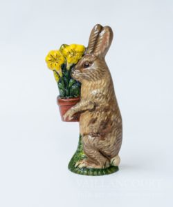 Bunny Carrying Yellow Lily In Clay Pot