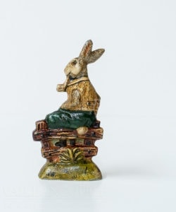 Rabbit Sitting on Fence with Eggs and Pipe