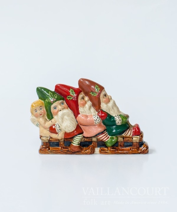 Three Gnomes and Angel on Sled