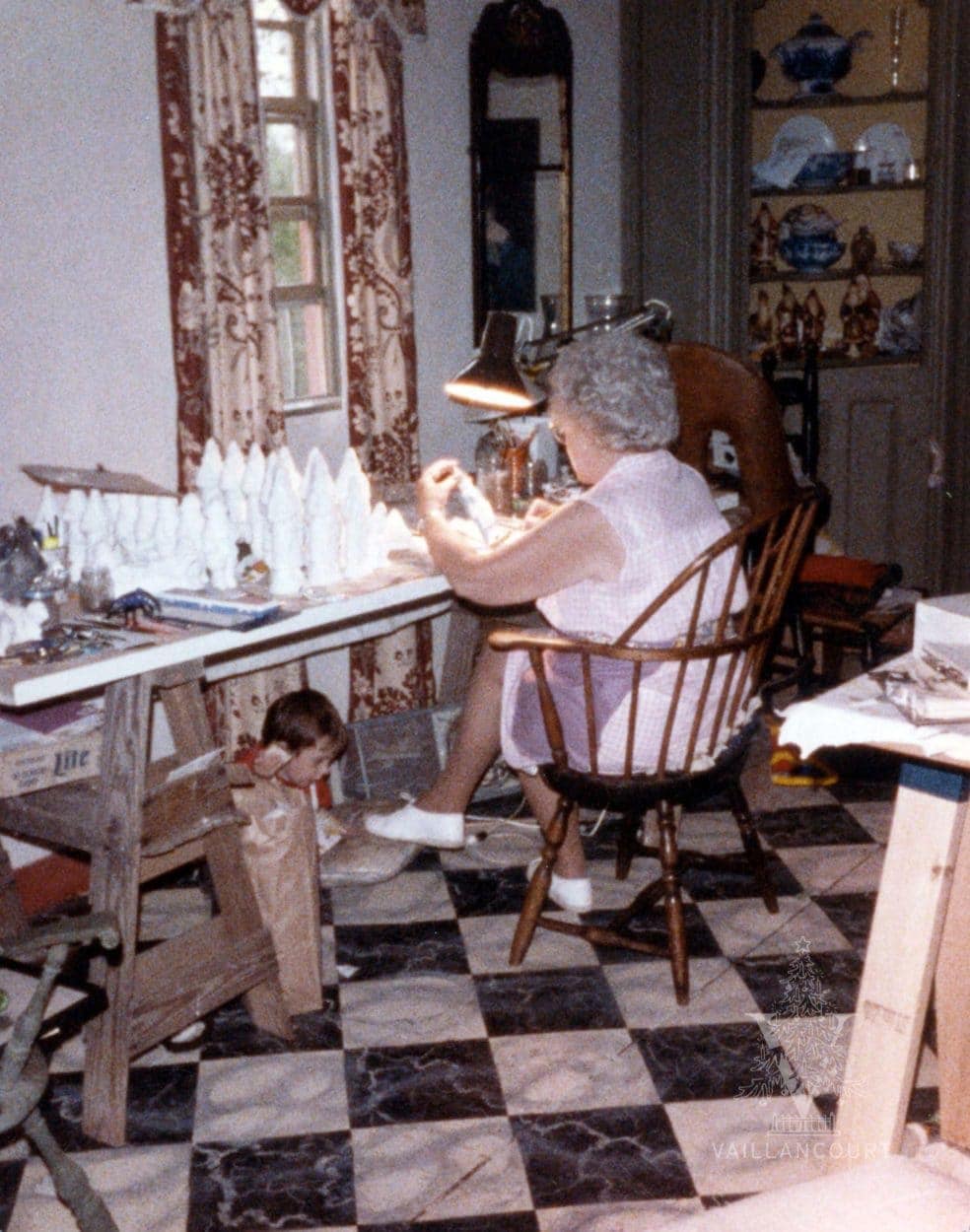 Judi's mother, Jessica, painting in the Vaillancourt's dining room in the mid 1980s (with son, Luke, playing under the painting desk).